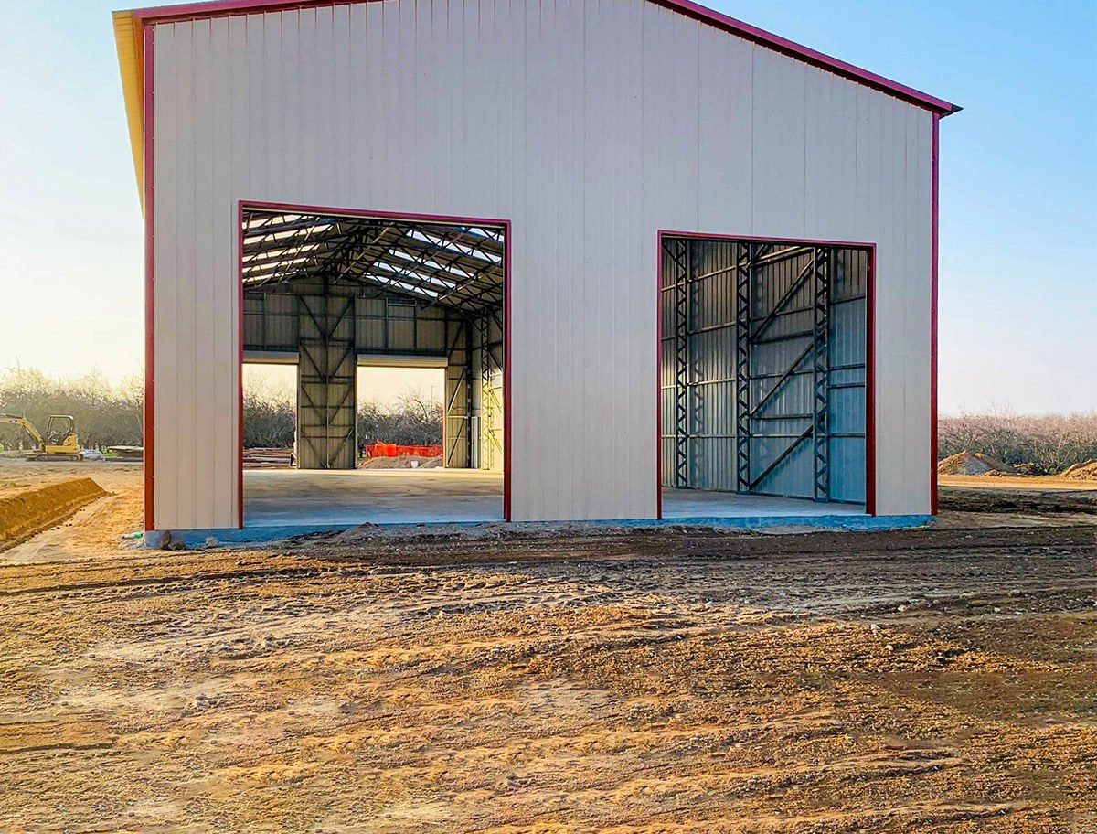 Steel building during installation with open framed bays
