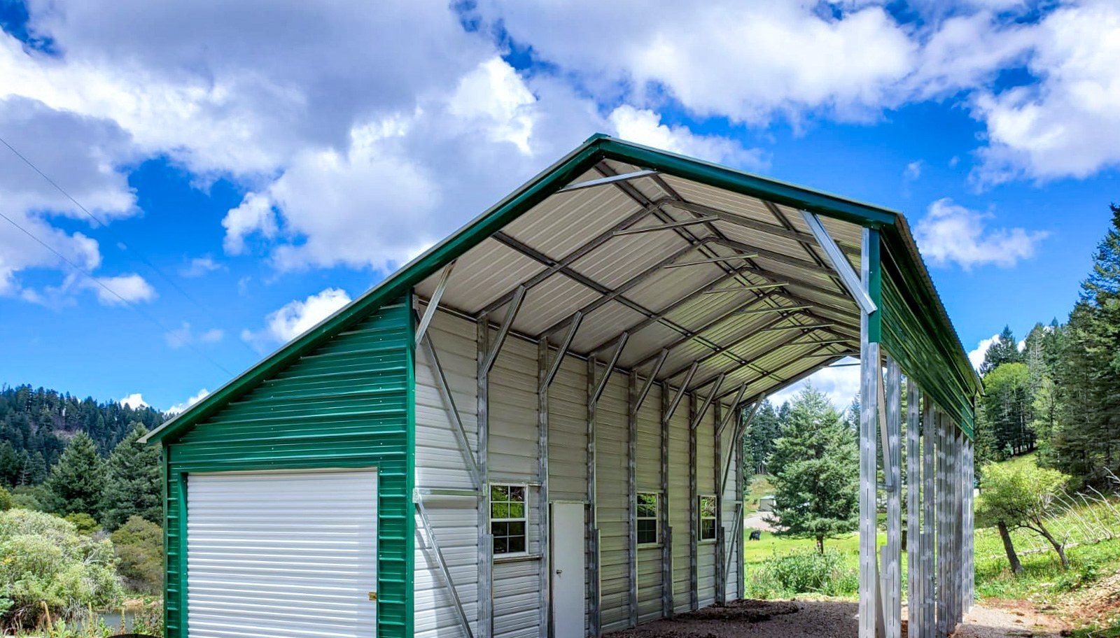 Green and white steel carport with enclosed utility storage section