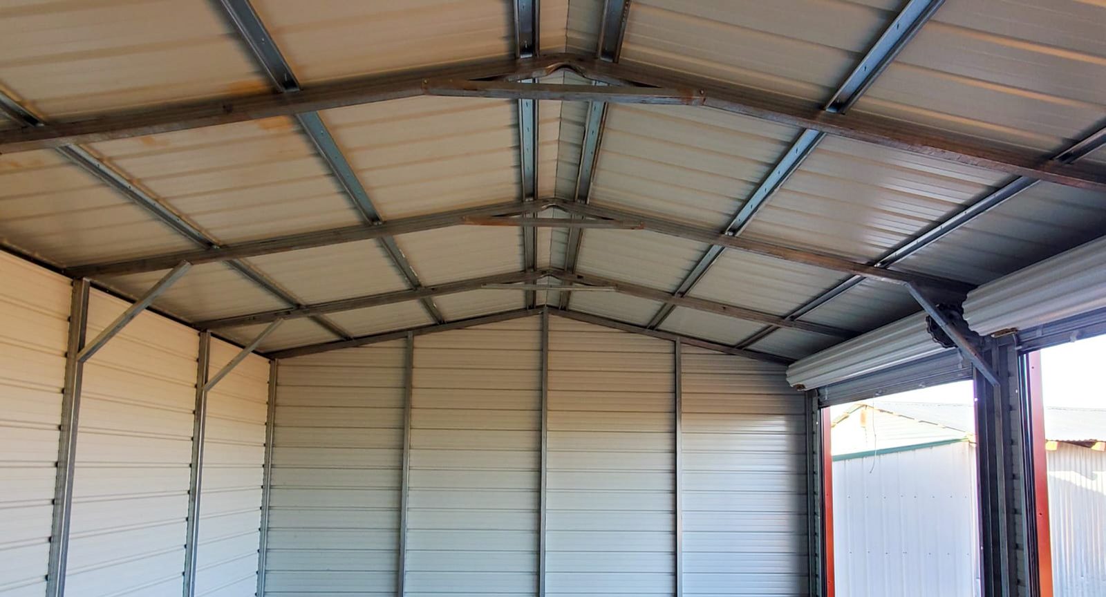 Interior view of steel carport with attached enclosed section